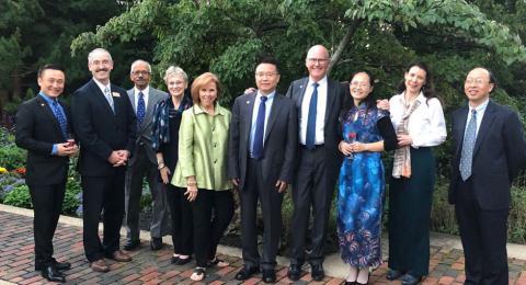UNH President Dean and Chengdu University President Wang (3rd and 4th from left) with other university staff